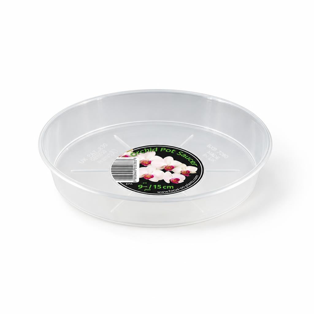 Transparent plastic saucer for an orchid grow pot