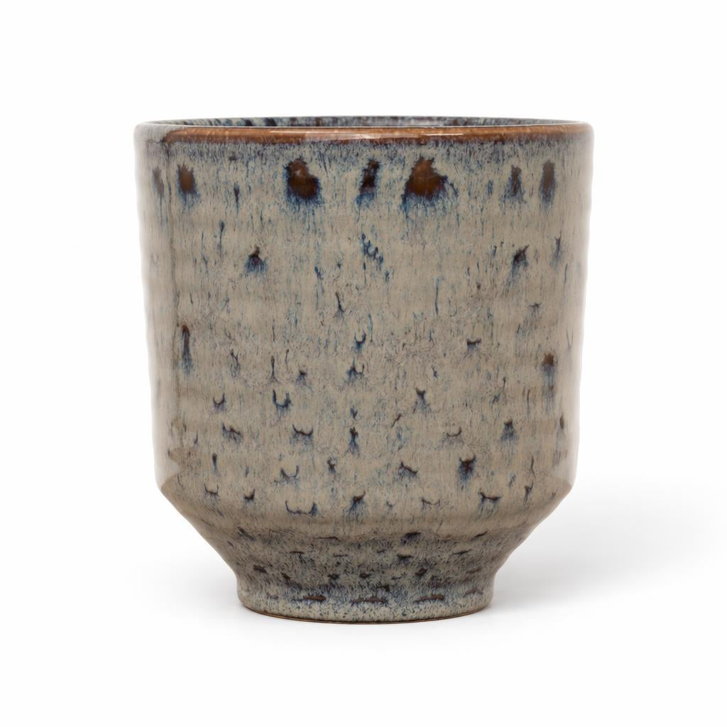 Mocha ceramic planter with a tapered body and dripped reactive glaze