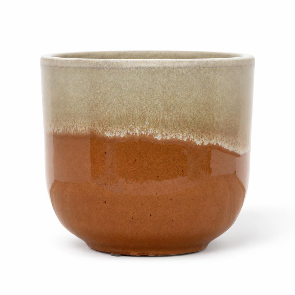 Rowe pot with a creamy white upper section and rust-coloured base