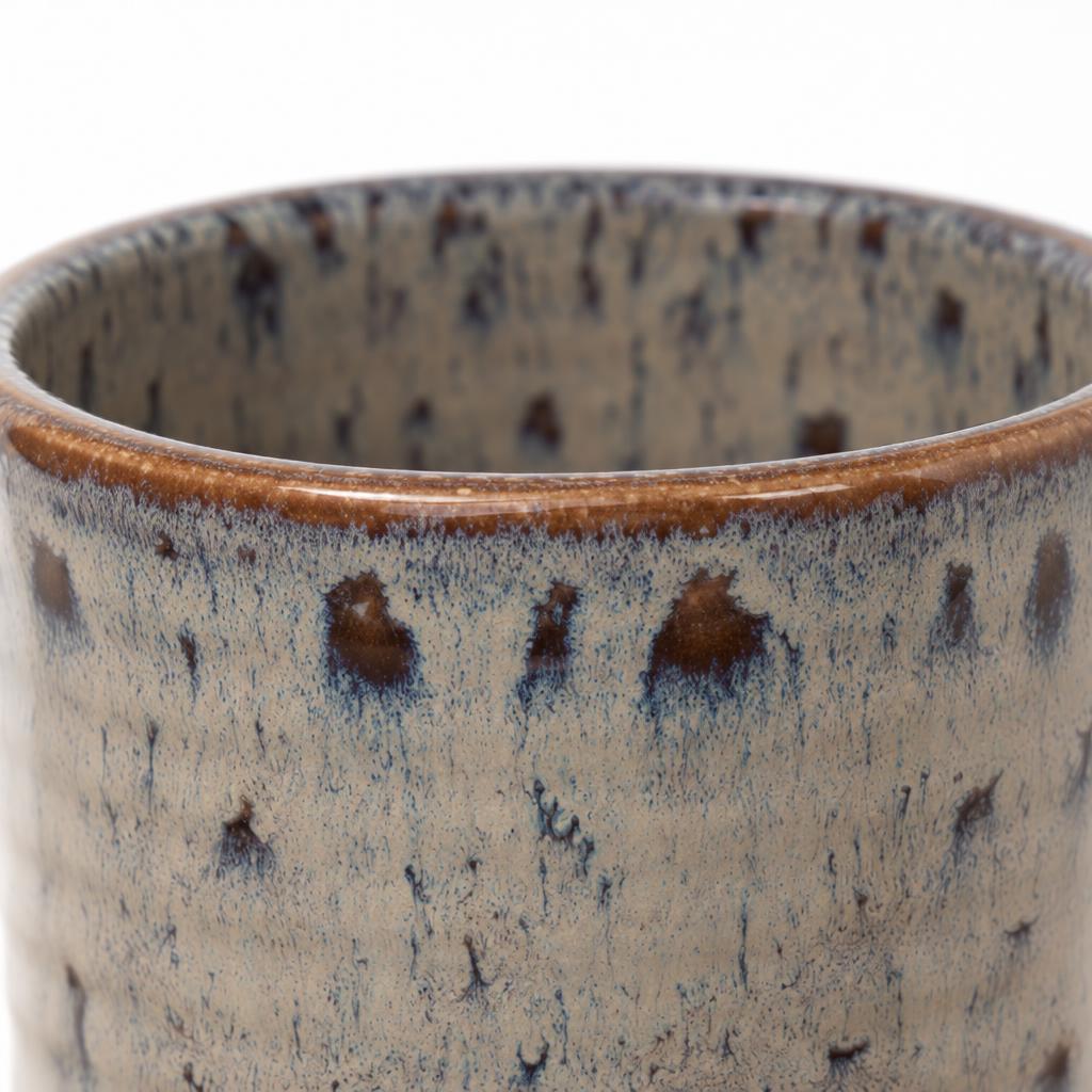 Reactive glaze planter with a brown rim and cream, charcoal and earthy tones